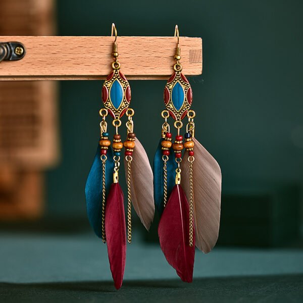Daisy's new creative retro tassel feather earrings women's long oil drop earrings European and American Bohemian jewelry