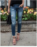 Cross-border hot style European and American foreign trade self-cultivation tassel pleated ripped hole elastic pencil pants jeans women - Image 4