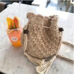 Japanese Xinsen women's retro small bag cotton and linen woven women's bag one-shoulder oblique span bucket bag tassel drawstring beach bag