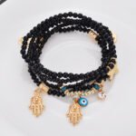 Factory direct sale one batch of multi-layer rice beads beaded fashion Buddha heart bracelet eye butterfly pendant bracelet - Image 3