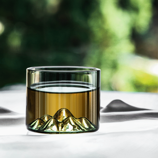 Distant mountain glass tea cup