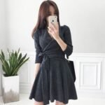 Knitted dress spring and autumn 2022 new Korean version V-neck women's decoration body slim bow long-sleeved A-line bottoming skirt