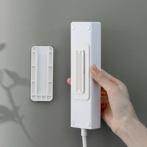 Plug-in fixture wall wall-mounted socket plug-in board free punch plug-in row storage artifact router hanging wall sticker