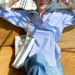 Spring new women's shirt women's long-sleeved blue and white striped French design color matching shirt women's commuting top