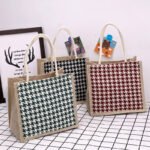 Japanese hand-held canvas women's bag trendy Korean cartoon printing bento handbag large-capacity simple check linen bag