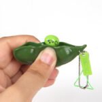 Cross-border squeezing edamame squeezing squeezing music decompression unlimited squeezing pinch pinch music pea pod key chain vent toy wholesale - Image 3