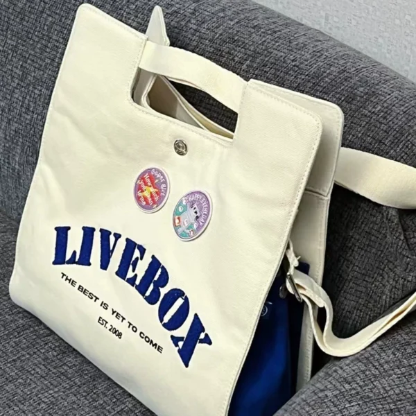 Japanese casual college style commuter Messenger bag female 2022 new student class portable single shoulder canvas bag