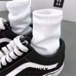 Autumn solid color versatile black and white men's and women's sports high stockings simple cotton soft men's socks Zhuji hosiery wholesale - Image 2