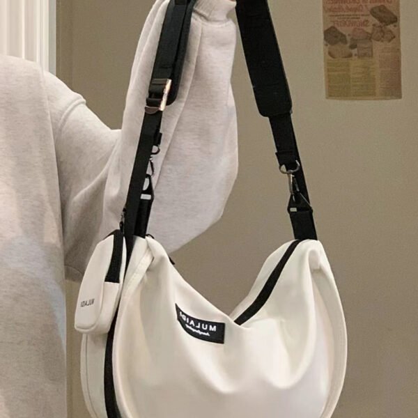 Japanese casual dumpling bag sports style Messenger bag female large capacity canvas bag student class single shoulder commuting bag tide