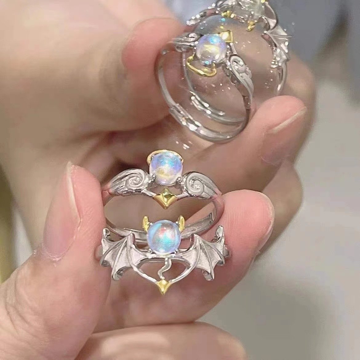 O1CN01xCgbLW1qr27R18VgH_2206574885548-0-cib.jpg 2022 New Angel and Demon Moonstone Couple Ring Fashion Opening Adjustable Gifts for Boys and Girls - Image 1